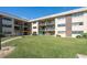 Well-maintained condo building with lush green lawn and private balconies for residents to enjoy at 2100 Ocean Shore Blvd # 1150, Ormond Beach, FL 32176