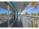 Private balcony with white railings offering a view of tropical landscape at 2596 Tulane Ave # 4, Daytona Beach, FL 32118