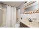 Clean bathroom with tub shower, vanity, and updated flooring at 2596 Tulane Ave # 4, Daytona Beach, FL 32118