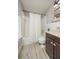 Clean bathroom with tub shower, vanity, and updated flooring at 2596 Tulane Ave # 4, Daytona Beach, FL 32118