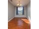 Simple dining room with hardwood floors and a chandelier at 2596 Tulane Ave # 4, Daytona Beach, FL 32118