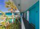 Bright hallway with teal walls, leading to condo units at 2596 Tulane Ave # 4, Daytona Beach, FL 32118