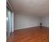 Bright living room with hardwood floors and sliding doors at 2596 Tulane Ave # 4, Daytona Beach, FL 32118