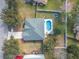 An aerial view of the home's backyard, showcasing the pool and fire pit at 46 Chrysanthemum Dr, Ormond Beach, FL 32174