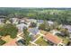 An aerial landscape view of a home with an in-ground pool in a fenced yard at 46 Chrysanthemum Dr, Ormond Beach, FL 32174