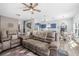 Open living space featuring plank floors with a view of the kitchen and dining area with great natural light at 46 Chrysanthemum Dr, Ormond Beach, FL 32174