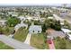 An elevated neighborhood view showcasing the home's placement among palm trees and neighboring houses at 5 Alamanda Dr, Ormond Beach, FL 32176