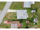 An aerial view of a well maintained house including a driveway, garden and its surrounding neighborhood at 5 Alamanda Dr, Ormond Beach, FL 32176