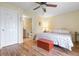 Bedroom featuring hardwood floors and an ensuite bathroom at 5 Alamanda Dr, Ormond Beach, FL 32176