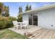 Back patio featuring outdoor seating with a garden at 5 Alamanda Dr, Ormond Beach, FL 32176