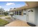 Inviting front entrance with a tiled walkway and light-blue exterior at 55 Neptune Ave, Ormond Beach, FL 32176