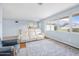 Living room with hardwood floors, comfy seating, and large windows at 55 Neptune Ave, Ormond Beach, FL 32176