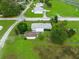 An aerial view showing home and neighborhood and lots of green, grassy lawns at 6680 Se 174Th Ln, Summerfield, FL 34491