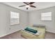 Bright bedroom features a ceiling fan, wood-look flooring, and natural light at 6680 Se 174Th Ln, Summerfield, FL 34491