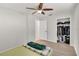 Bedroom with wood-look floors, walk-in closet and natural light at 6680 Se 174Th Ln, Summerfield, FL 34491