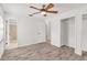 Bedroom with wood-look floors, closet, and natural light coming from windows at 6680 Se 174Th Ln, Summerfield, FL 34491