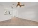 Bright open living room with a ceiling fan, tile flooring, and fresh white walls at 6680 Se 174Th Ln, Summerfield, FL 34491