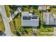 Roof view shows solar panels. A hot tub and outdoor lounge area add to the charm of the yard at 100 Lynnhurst Dr, Ormond Beach, FL 32176