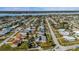 Aerial photo showing the house with a view of the neighborhood situated near a large body of water at 100 Lynnhurst Dr, Ormond Beach, FL 32176