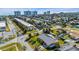 Aerial shot of neighborhood featuring the house, nearby condos, and tropical foliage at 100 Lynnhurst Dr, Ormond Beach, FL 32176