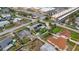 Aerial view featuring a property with solar panels, a well-maintained lawn, and a fenced backyard at 100 Lynnhurst Dr, Ormond Beach, FL 32176