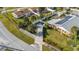 Overhead image showing a well-kept yard, a white picket fence, and a house with solar panels at 100 Lynnhurst Dr, Ormond Beach, FL 32176