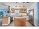 Well-equipped kitchen with stainless steel appliances, island, and ample counter space at 100 Lynnhurst Dr, Ormond Beach, FL 32176