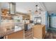 Well-lit kitchen featuring white cabinets, stainless steel appliances, granite countertops, and island at 100 Lynnhurst Dr, Ormond Beach, FL 32176