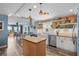 Bright open-concept kitchen featuring modern appliances, island, and adjacent dining area at 100 Lynnhurst Dr, Ormond Beach, FL 32176