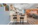 Open floor plan featuring kitchen with breakfast bar, and bright living area with comfortable seating at 100 Lynnhurst Dr, Ormond Beach, FL 32176