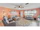 Inviting living room with comfortable seating, decorative rug, and a bright, airy feel at 100 Lynnhurst Dr, Ormond Beach, FL 32176