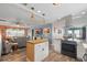 Open-concept living featuring a well-equipped kitchen open to the living room and dining area at 100 Lynnhurst Dr, Ormond Beach, FL 32176