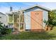 Outdoor shed and greenhouse structure with a garden at 100 Lynnhurst Dr, Ormond Beach, FL 32176