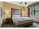 Bright bedroom with queen bed, decorative lamps, soft linens, and neutral decor at 12544 Floridays Resort Dr # 507-B, Orlando, FL 32821