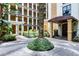 Exterior courtyard featuring beautiful landscaping, plants, and manicured shrubbery at 12544 Floridays Resort Dr # 507-B, Orlando, FL 32821