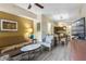 Cozy living room with sofa, armchair, and dining area with kitchen view at 12544 Floridays Resort Dr # 507-B, Orlando, FL 32821