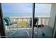 Balcony with comfortable chairs and a view of the ocean at 1575 Ocean Shore Blvd # 205, Ormond Beach, FL 32176