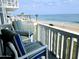 Relaxing balcony with seating overlooking the ocean, perfect for enjoying the views and sea breeze at 1575 Ocean Shore Blvd # 205, Ormond Beach, FL 32176