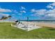 Scenic picnic area near the beach, featuring tables, umbrellas, and lush greenery, perfect for outdoor gatherings at 1575 Ocean Shore Blvd # 205, Ormond Beach, FL 32176