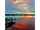 Gorgeous sunset view of the pier at the waterfront with colorful sky reflections at 1575 Ocean Shore Blvd # 205, Ormond Beach, FL 32176