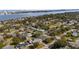 An aerial shot shows homes in a waterfront neighborhood, with a clear view of the nearby cityscape at 1705 Cordova Ave, Daytona Beach, FL 32117