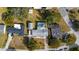A bird's eye view of the home shows an in-ground pool, driveway, and peaceful residential area at 1705 Cordova Ave, Daytona Beach, FL 32117
