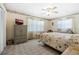 Comfortable bedroom with soft carpet, floral accents, and ample natural light from large windows at 1705 Cordova Ave, Daytona Beach, FL 32117