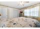 Inviting bedroom featuring floral bedding, soft lighting, and closet space for storage at 1705 Cordova Ave, Daytona Beach, FL 32117