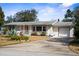 Lovely single Gathering home with attached garage, manicured lawn, and mature landscaping at 1705 Cordova Ave, Daytona Beach, FL 32117