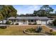 Charming single-story home with well-maintained front yard and an attached one-car garage at 1705 Cordova Ave, Daytona Beach, FL 32117