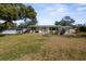 Charming single-story home featuring a well-manicured lawn and tidy landscaping at 1705 Cordova Ave, Daytona Beach, FL 32117