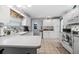 Bright kitchen featuring white cabinets, laminate counters and tile floors at 1705 Cordova Ave, Daytona Beach, FL 32117