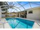 Enjoy the sparkling pool and covered patio of this inviting backyard at 1705 Cordova Ave, Daytona Beach, FL 32117