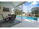 Enclosed pool area with outdoor seating, perfect for entertaining and relaxation at 1705 Cordova Ave, Daytona Beach, FL 32117